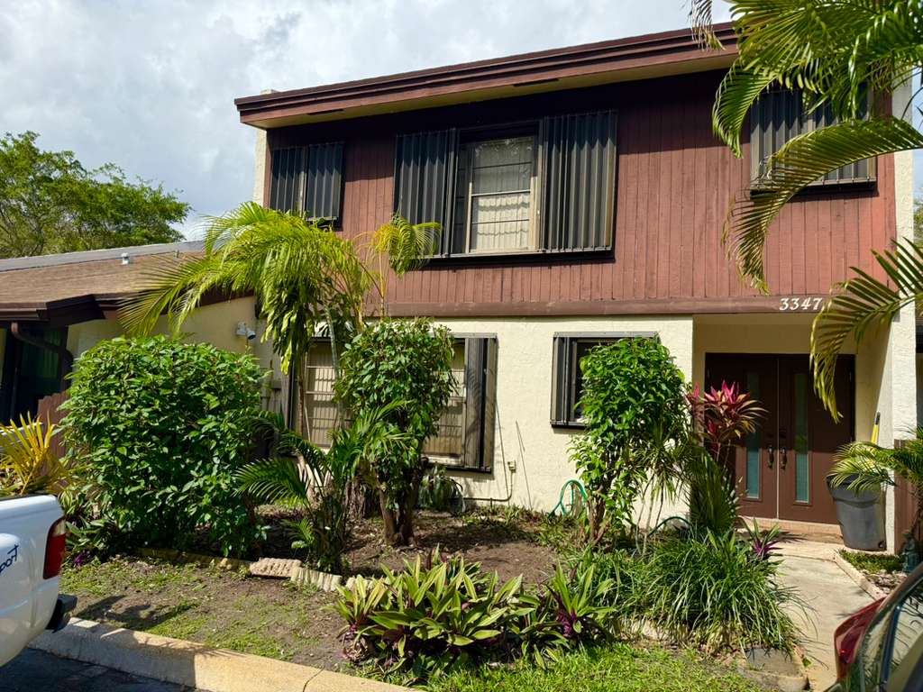 Lawn Transformation - Tamarac - Before professional lawn care and landscaping service by The Fresh Feel in South Florida